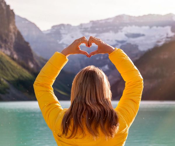 A calm and serene landscape with a lake at dawn, symbolizing peace of mind.